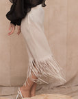 Pleated Midi Skirt with multi fringed tassel hem design in white