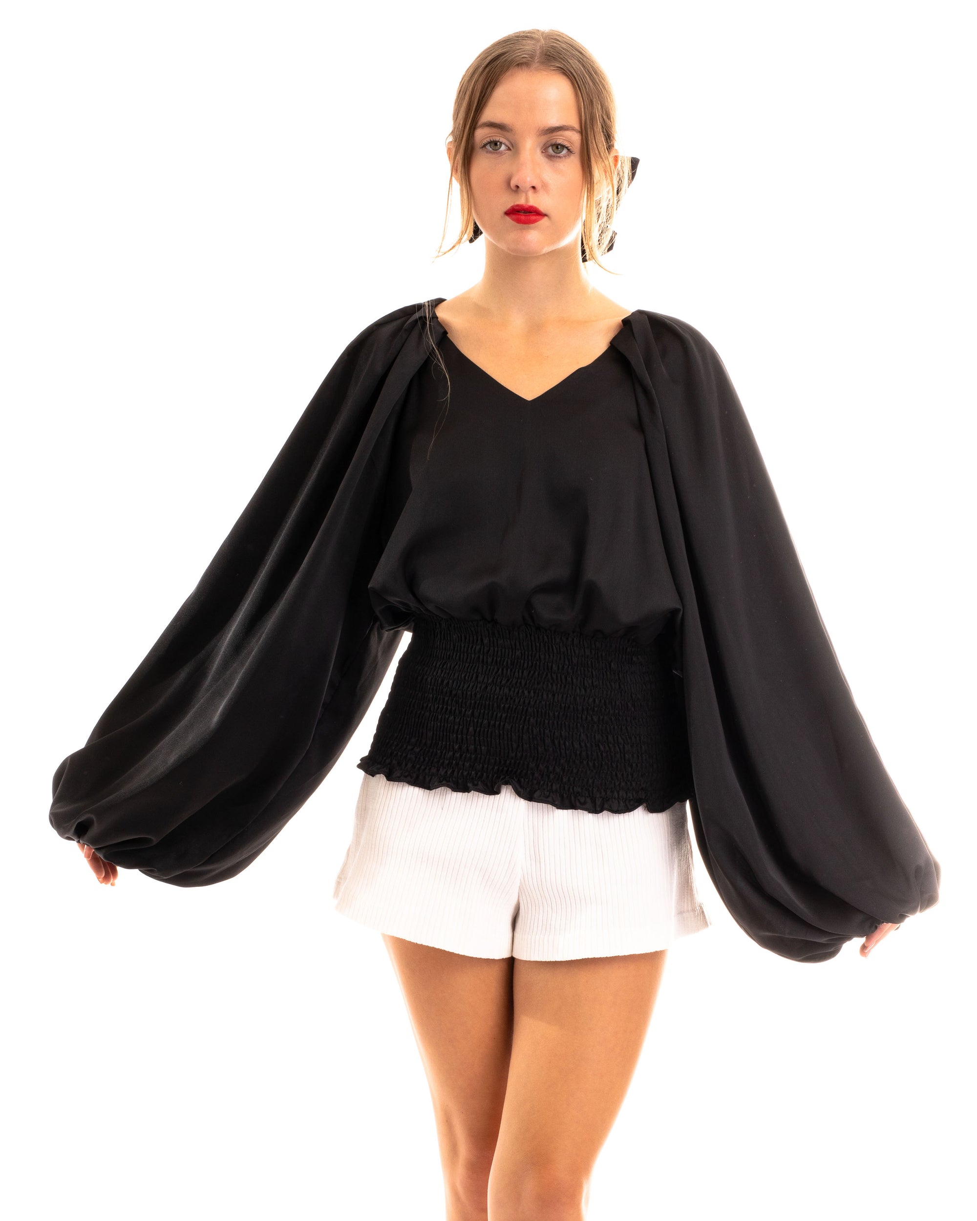 Puff sleeve smocked top in black