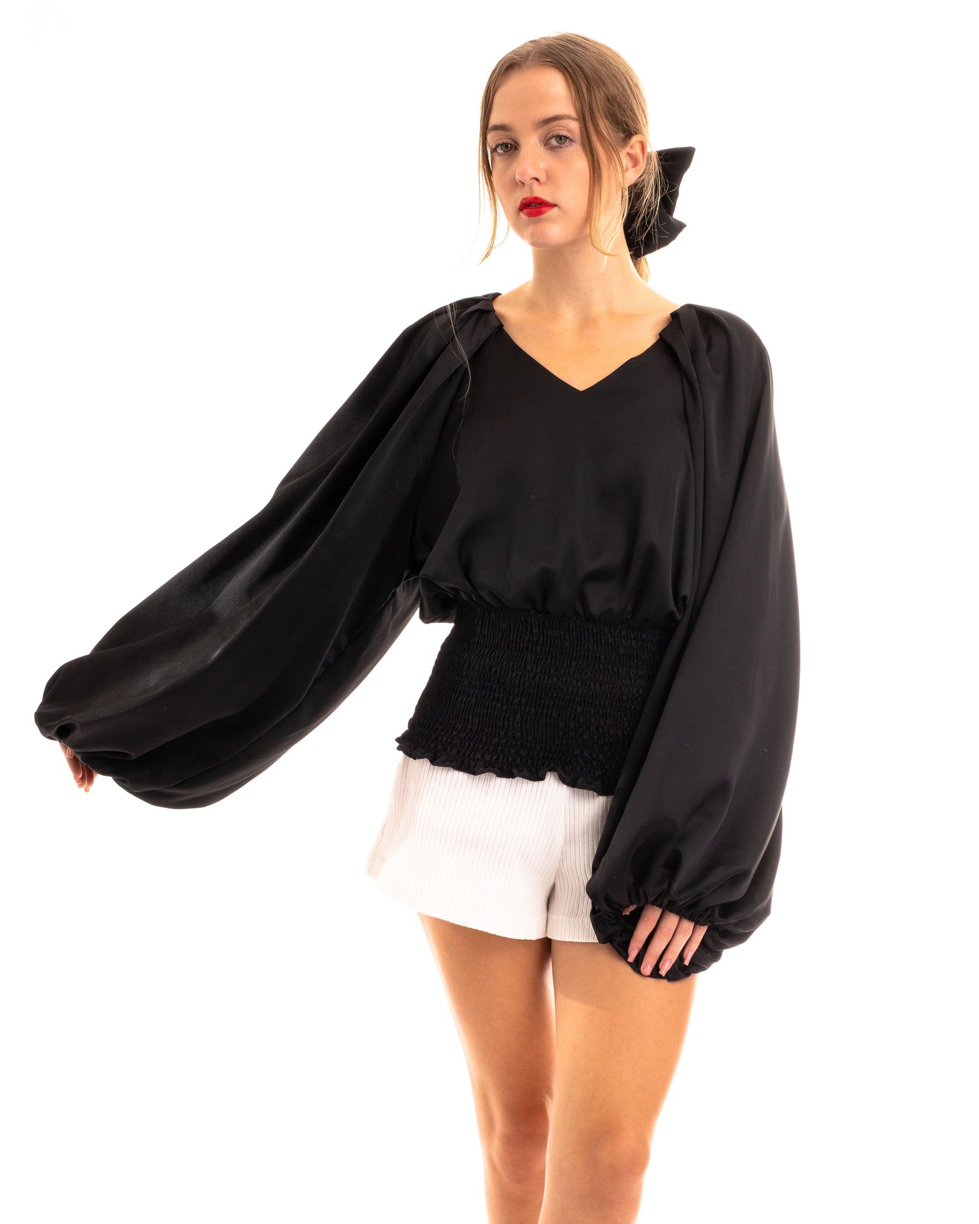 Puff sleeve smocked top in black