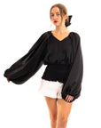 Puff sleeve smocked top in black